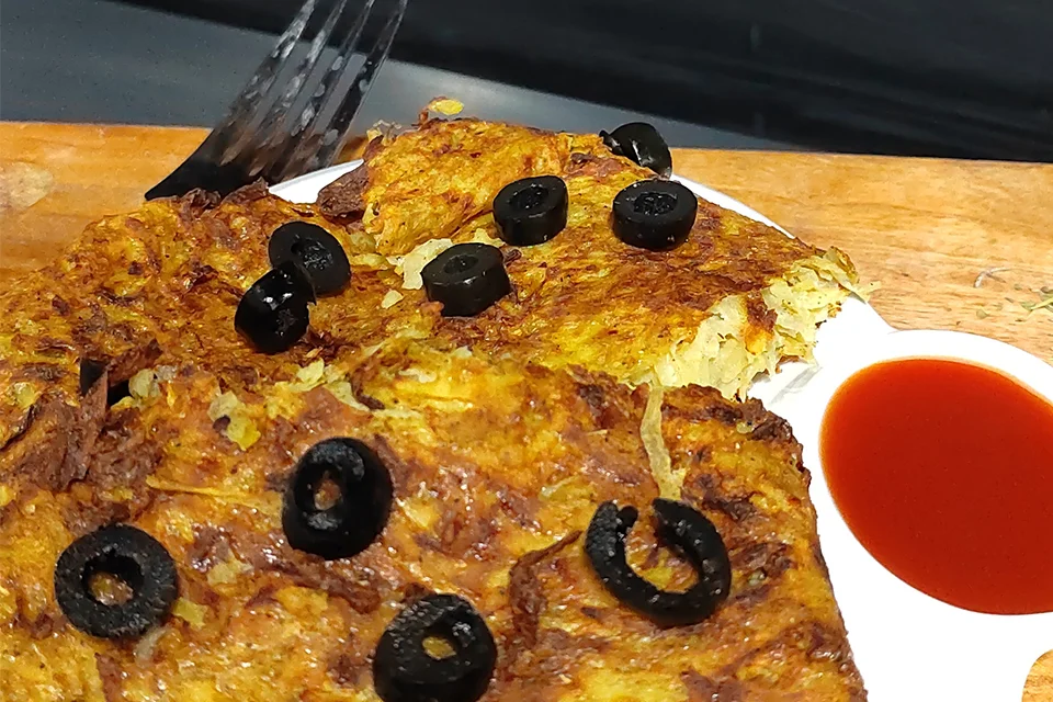 Air Fryer Hash Browns Recipe Served in white platter with ketchup