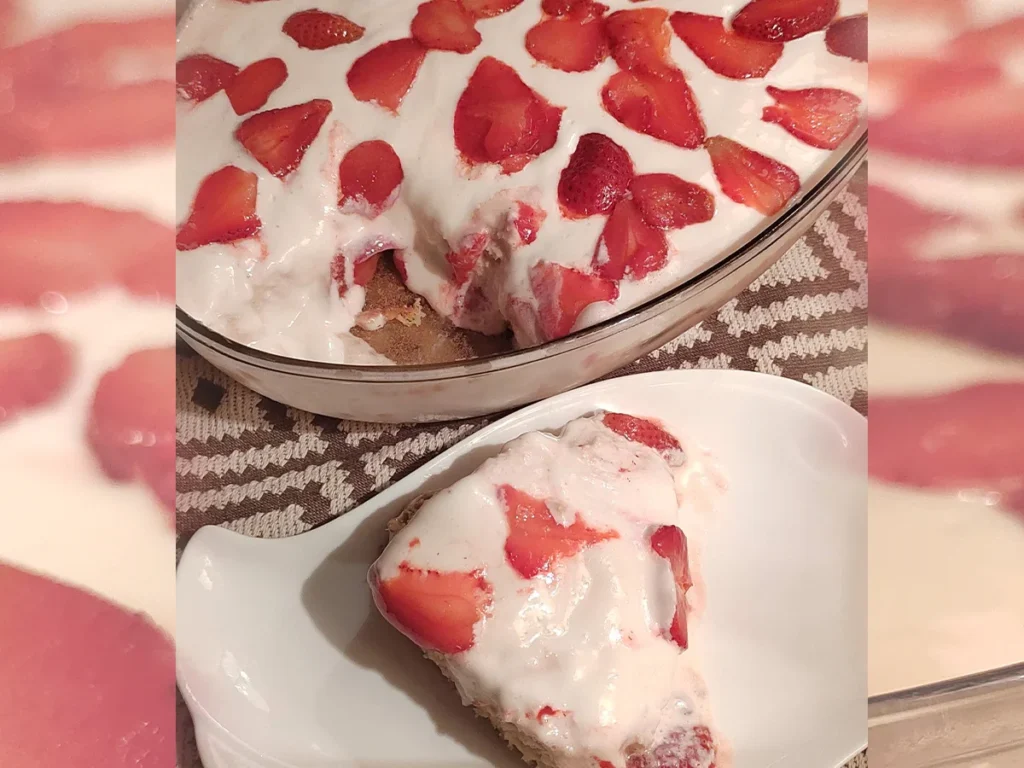 Close up image of Strawberry Tres Leches Cake Slice of Strawberry Tres Leches Cake with whole cake served in a dish