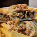 Close up image of tortilla wraps with juicy chicken filling