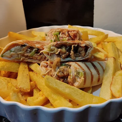 Juicy and cheesy tortilla wraps served with fries