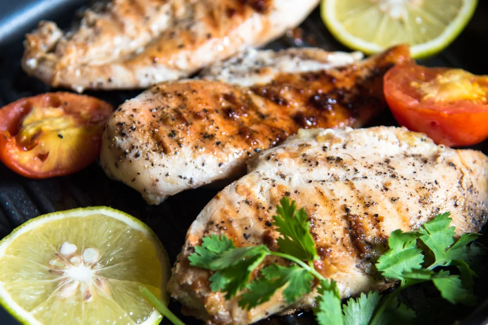Gluten Free Grilled Lemon Pepper Chicken Served with Lemon Slices Grilled Lemon Pepper Chicken Served with lemon slices and grilled tomatoes