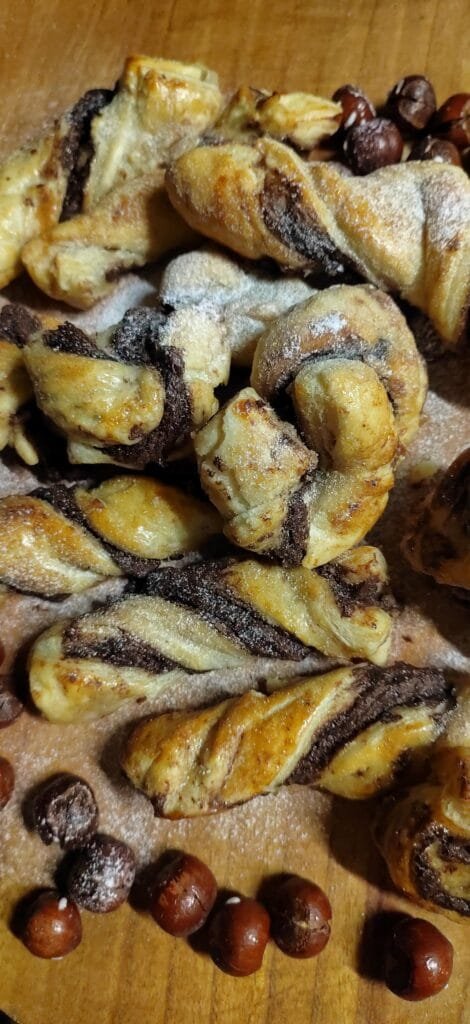 Puff Pastry Dessert Served on board Closeup image of Puff Pastry Dessert with Nutella