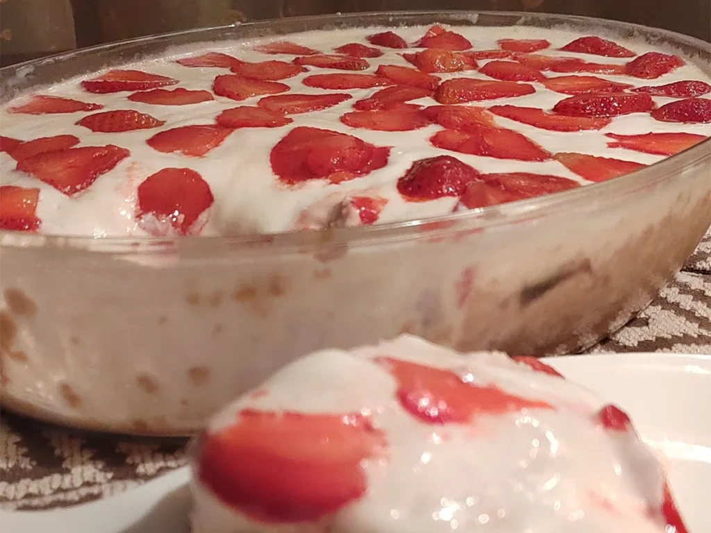 Strawberry Tres Leches Cake with cream and Strawberry topping Slice of Strawberry Tres Leches Cake