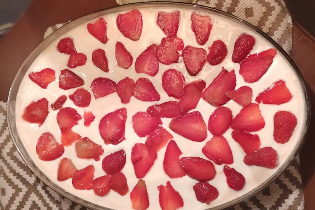 Top view image of Strawberry Tres Leches Cake Top view image of strawberry tres leches cake with strawberry and cream topping
