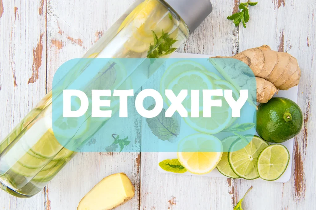 Detox water in transparent bottle with ginger lemon and lime