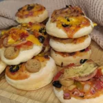 Mini Pizza with homemade pizza dough served on food board