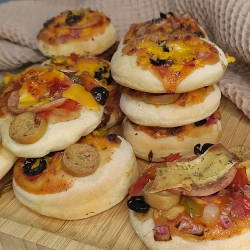 Mini Pizza with homemade pizza dough served on food board