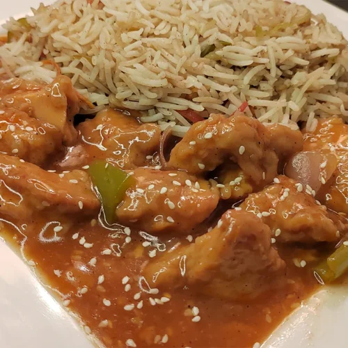 Top View Image of Chicken Manchurian Served with Egg Fried Rice